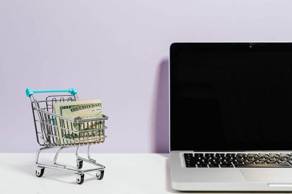 MacBook and tiny shopping trolley